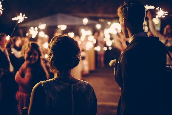 just4uentertainment image of a couple looking on at guests at their Salt Lake City Utah wedding reception